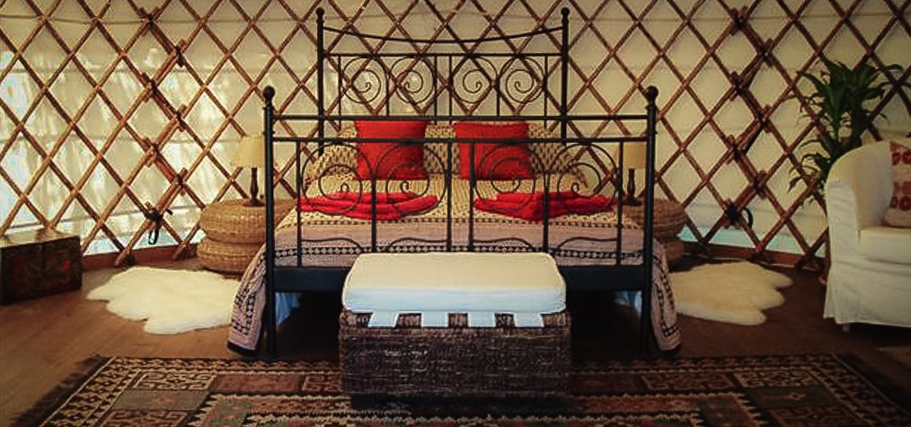 Complete Yurt Workshop yurt with natural chestnut frame, oak crown and canvas covers